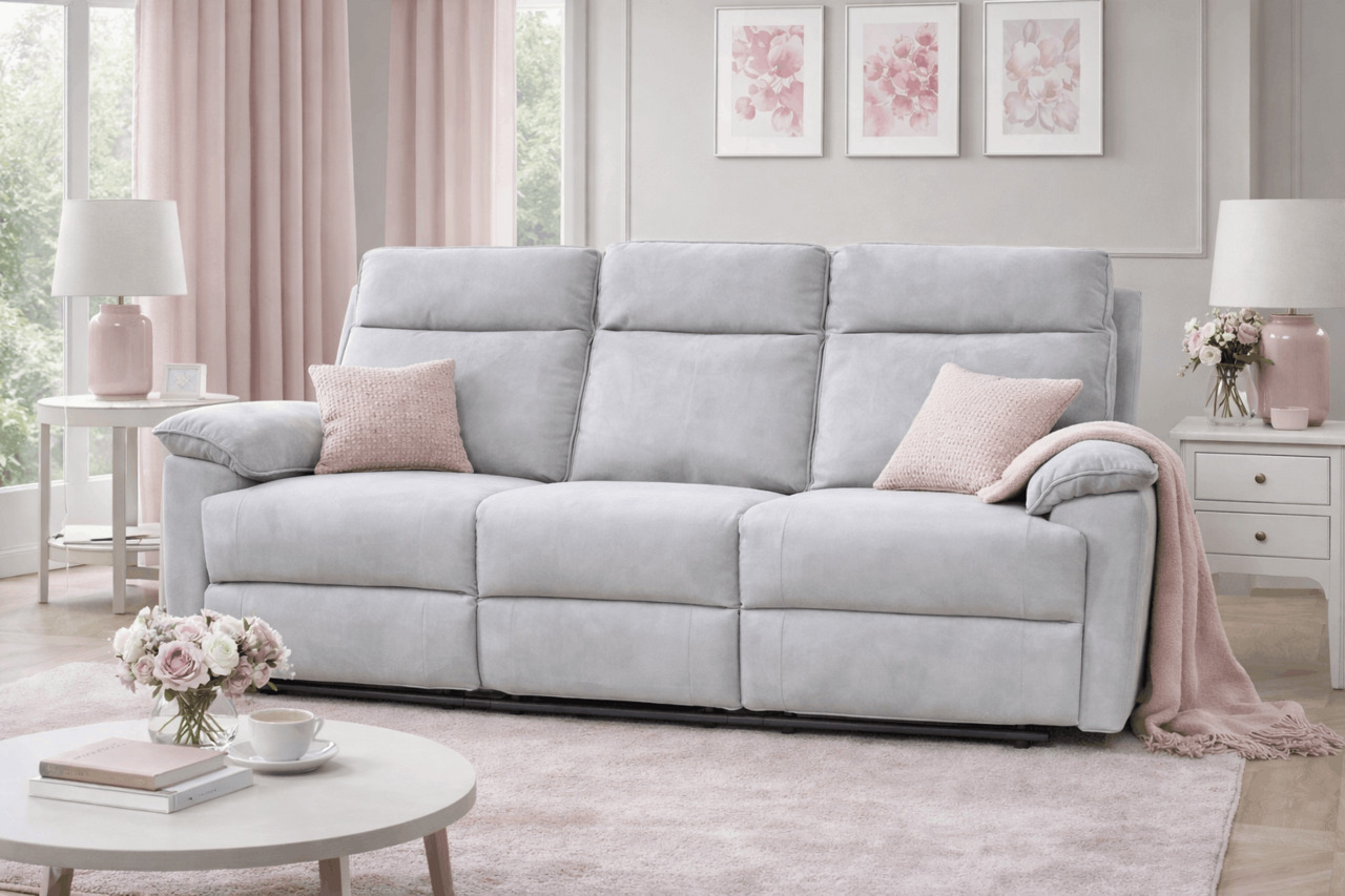 Light grey reclining sofa with blush pink decor