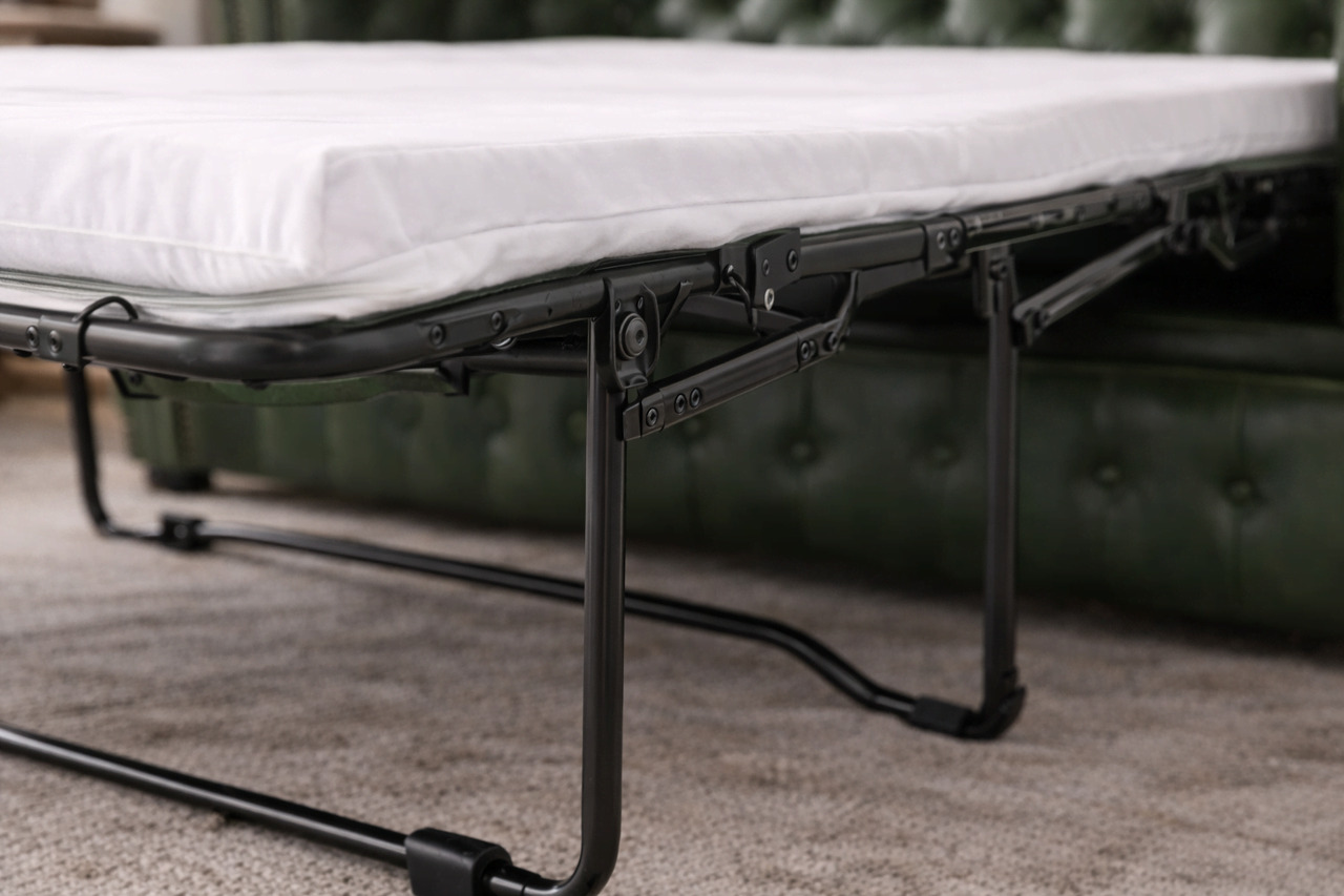 Pull-out sofa bed mechanism close-up with white mattress