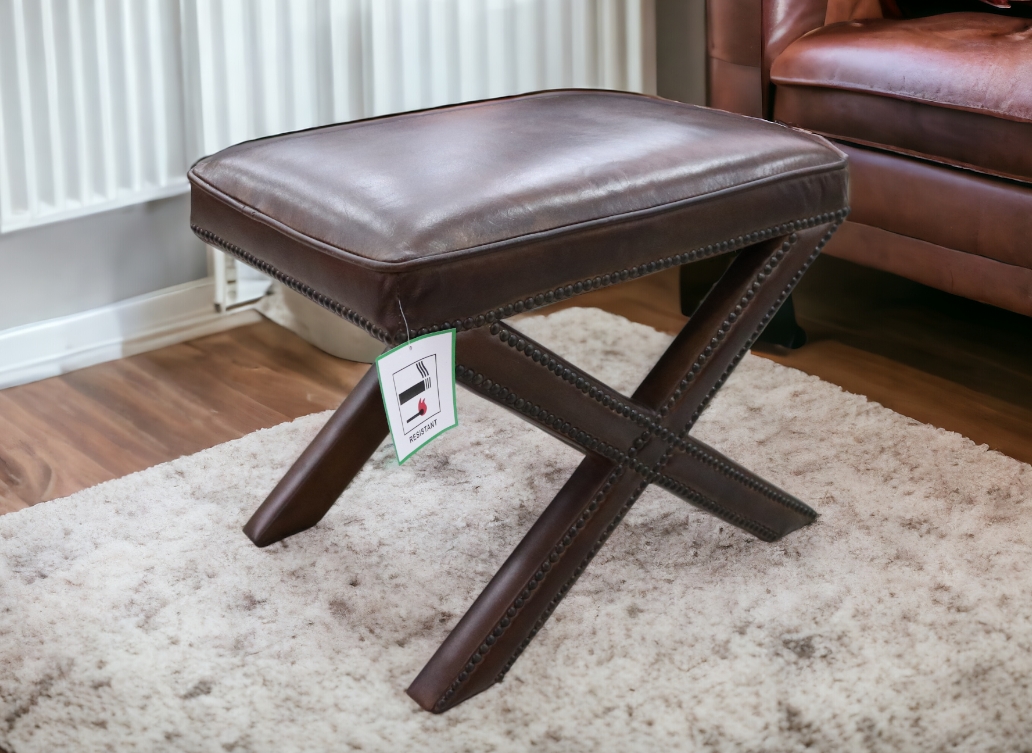 Brown leather store footstool