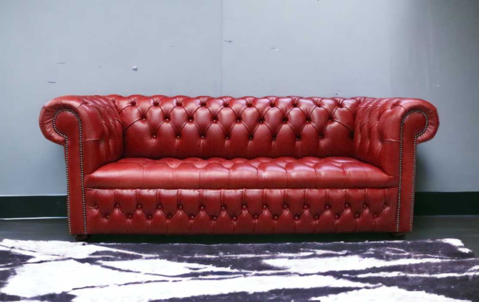 Product photograph of Chesterfield 3 Seater Settee Buttoned Seat Old English Crimson Leather Sofa from Designer Sofas 4U