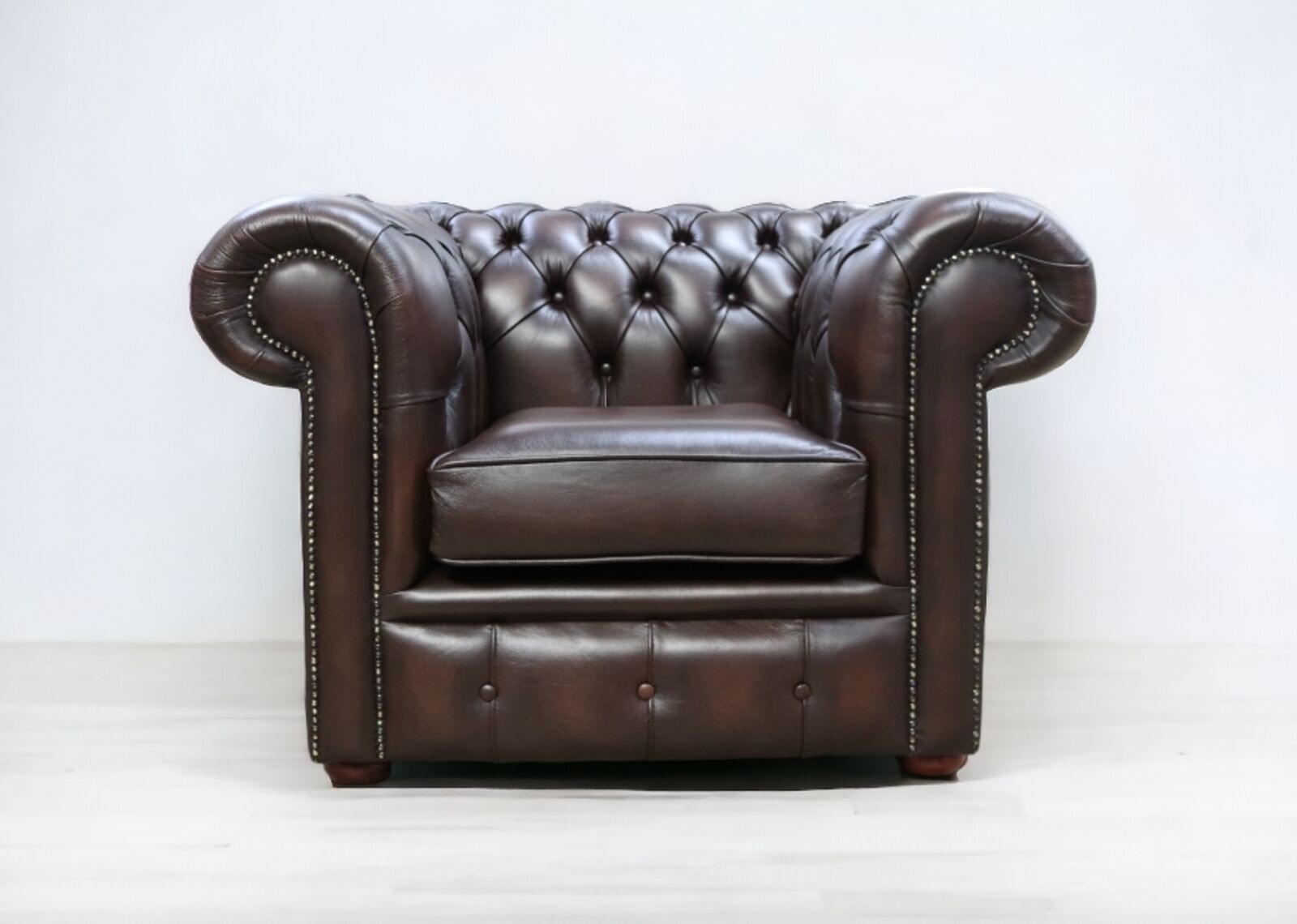 Product photograph of Chesterfield Low Back Club Armchair Antique Brown Real Leather Stock from Designer Sofas 4U