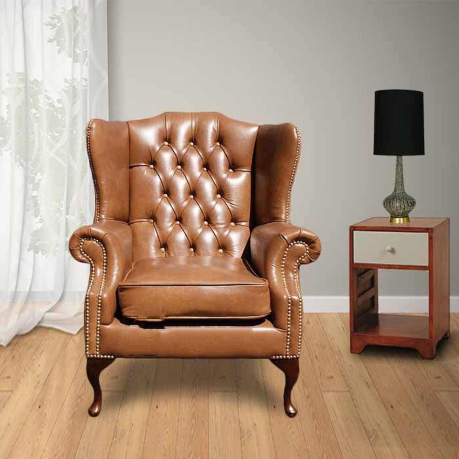 Product photograph of Chesterfield Highclere High Back Wing Chair Uk Manufactured Old English Tan Leather With Matching Footstool Brass Studs from Designer Sofas 4U