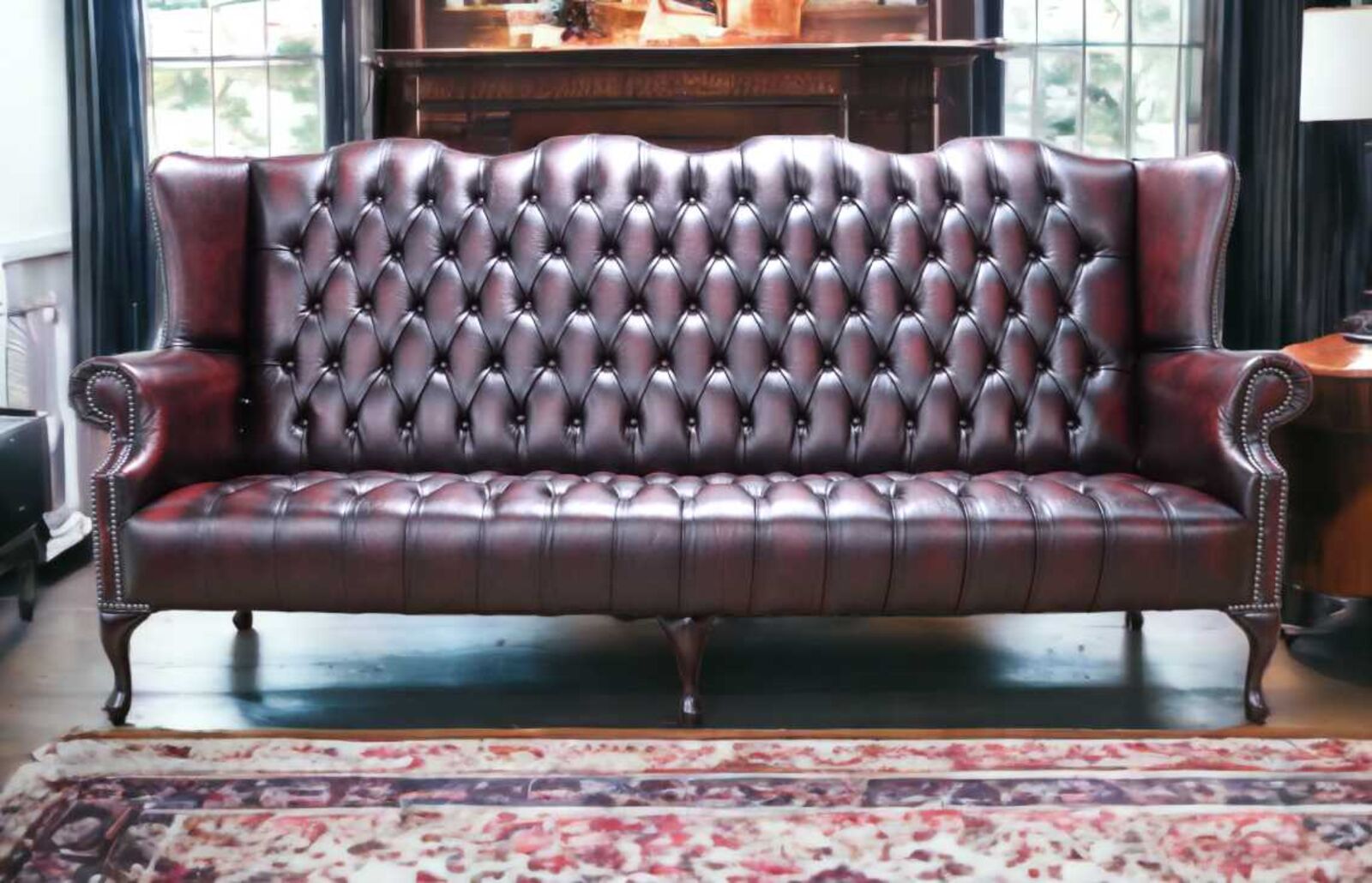 Product photograph of Chesterfield 4 Seater Queen Anne Buttoned Seat High Back Wing Sofa Antique Oxblood Leather from Designer Sofas 4U