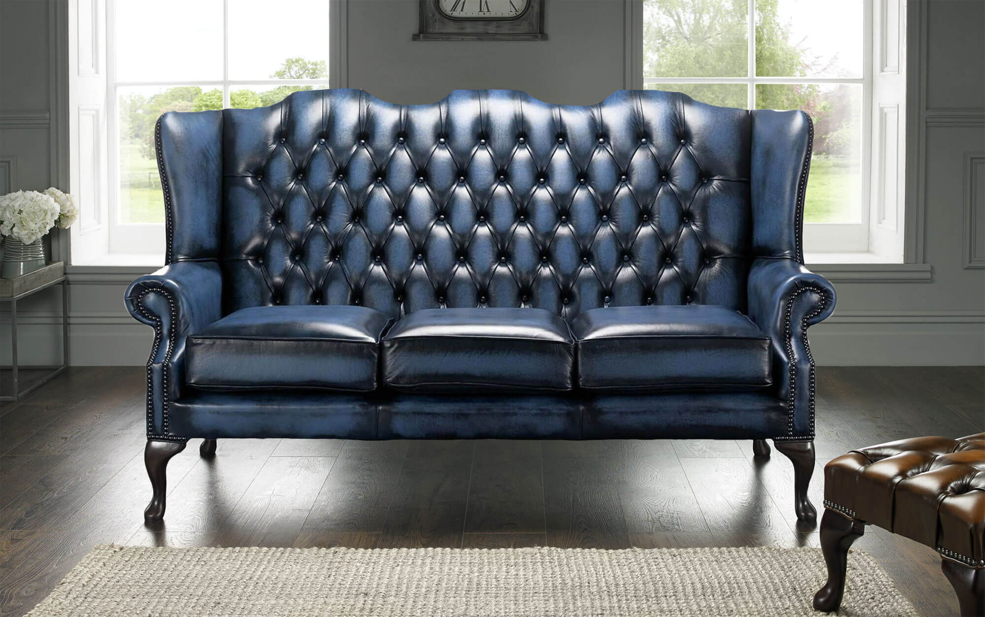 Dark blue store chesterfield sofa