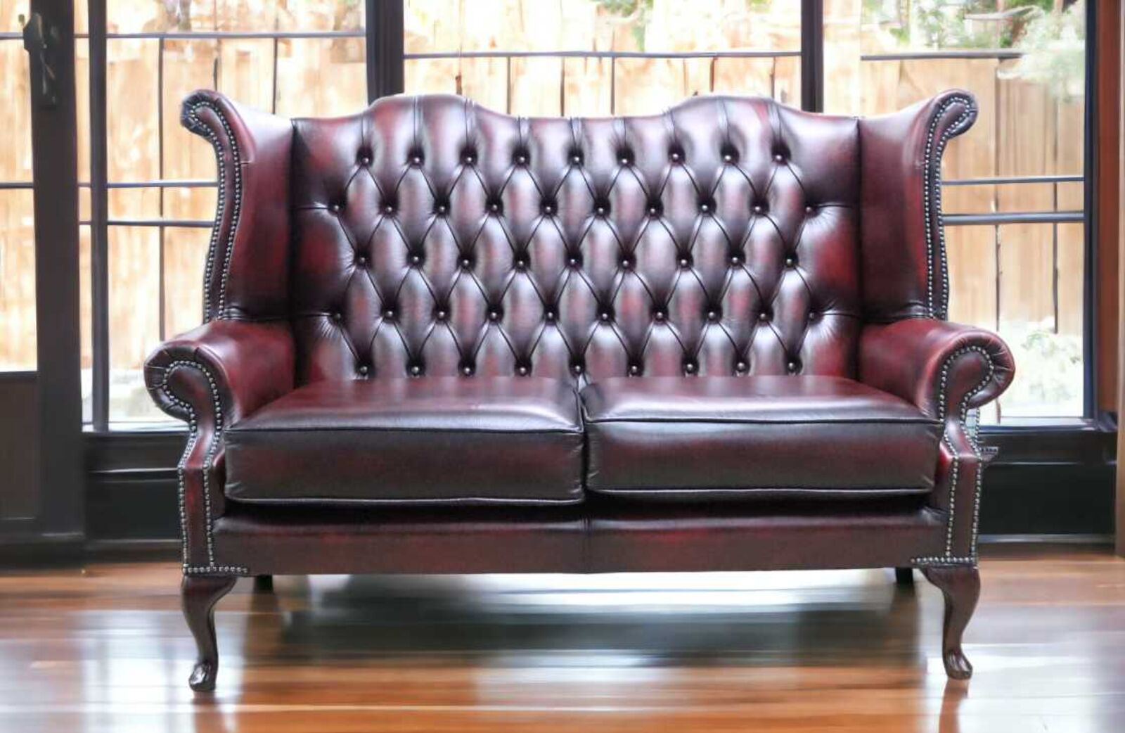 Product photograph of Chesterfield 2 5 Seater Queen Anne High Back Wing Sofa Antique Oxblood from Designer Sofas 4U