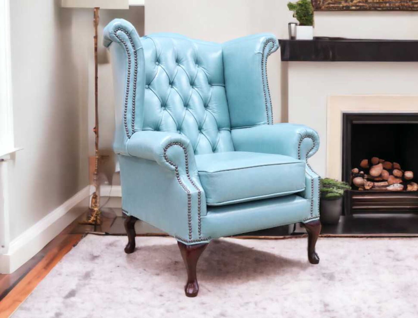 Product photograph of Chesterfield Queen Anne High Back Wing Chair Old English Placid Lake Blue Leather from Designer Sofas 4U