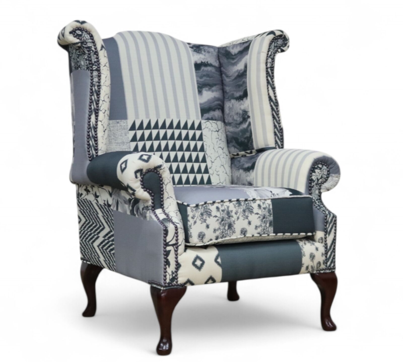 Product photograph of Chesterfield Saxon Queen Anne High Back Wing Chair Charles Patchwork Beige from Designer Sofas 4U