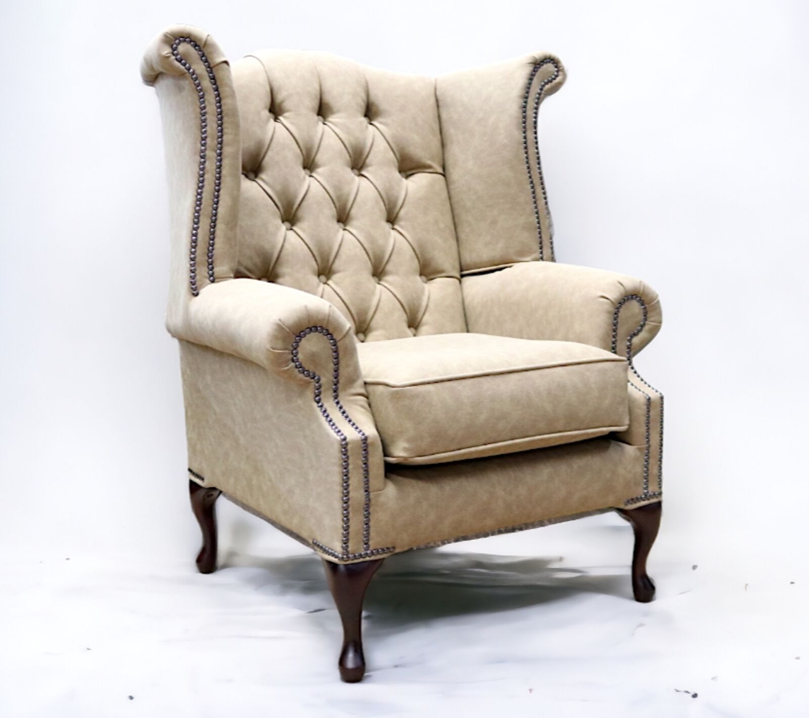 Product photograph of Chesterfield Handmade Queen Anne Wing Chair Desert Sand Leather from Designer Sofas 4U