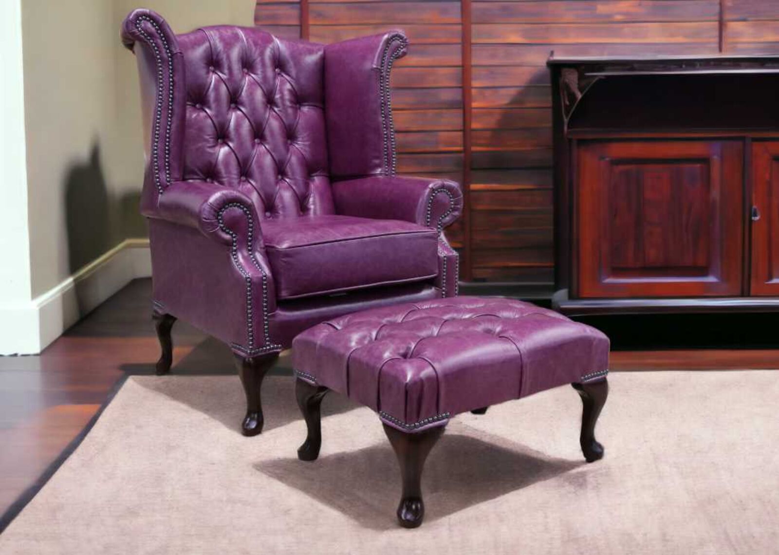 Product photograph of Chesterfield Queen Anne High Back Chair Old English Plum Leather With Footstool from Designer Sofas 4U