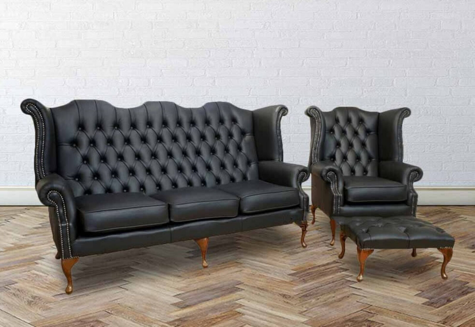 Product photograph of Chesterfield 3 Seater Queen Anne High Back Wing Chair With Footstool Uk Manufactured Black from Designer Sofas 4U